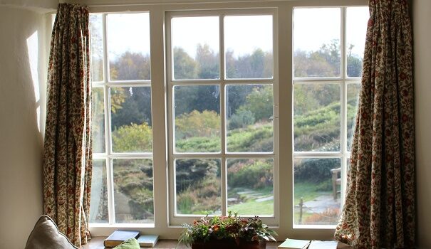 Long curtains framing a garden window